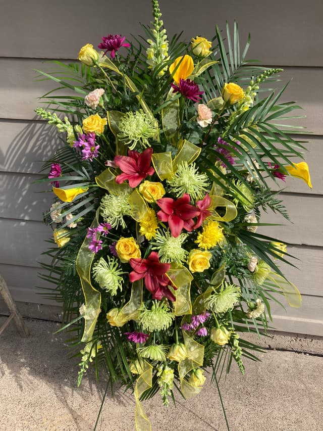 Standing easel spray with tropical flowers and greenery