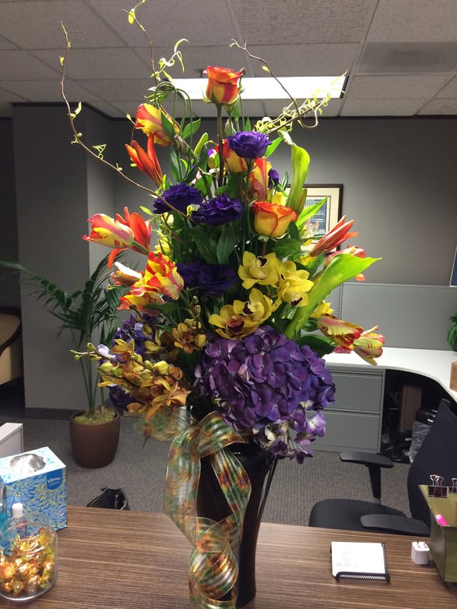 Colorful anniversary arrangement with lilies and hydrangea