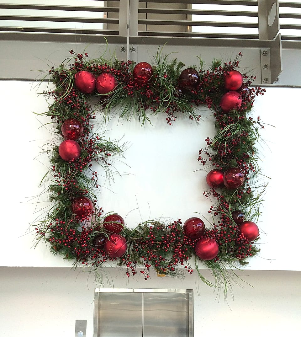 Extra-large square evergreen wreath with red ornaments and berries