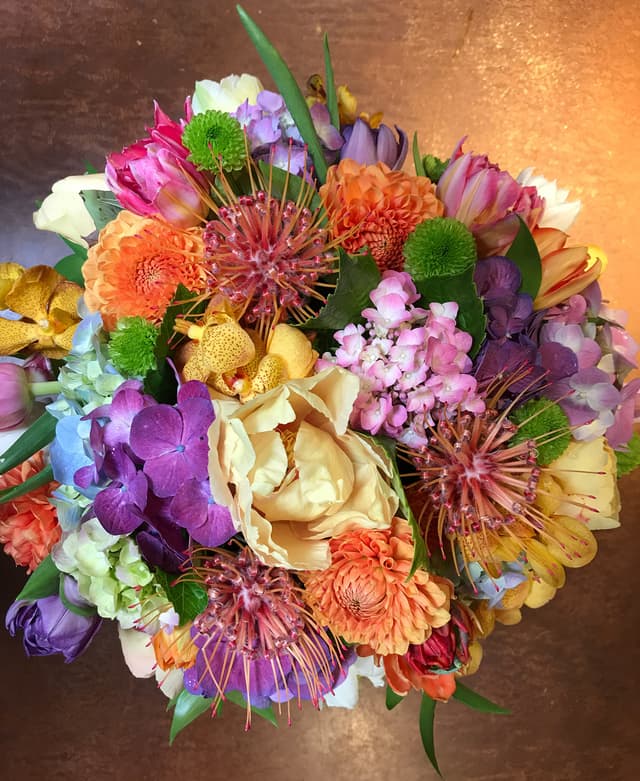 Multicolor pavé design of roses, hydrangea, pincushion protea, and mums