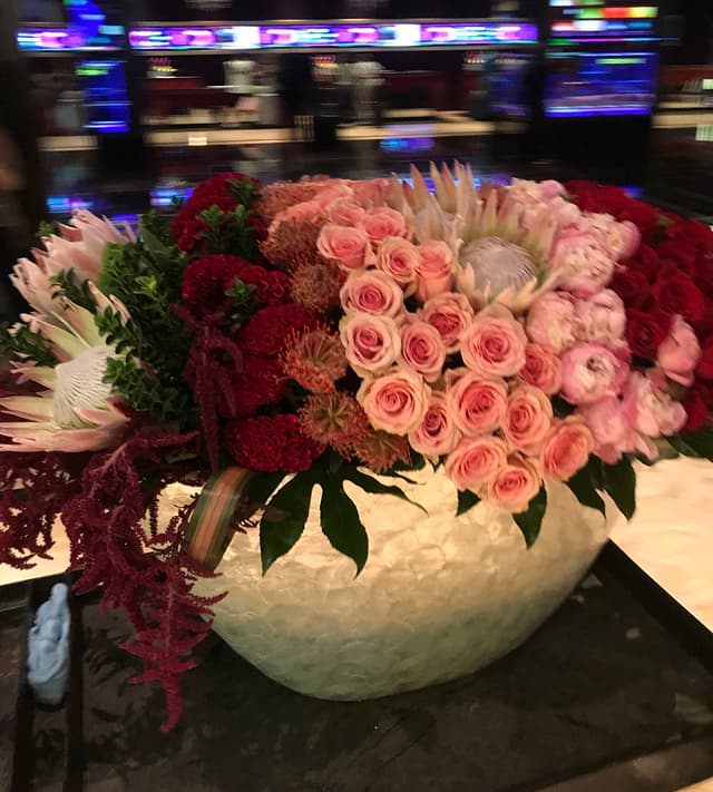 Dramatic event arrangement of pink roses in ombré shades