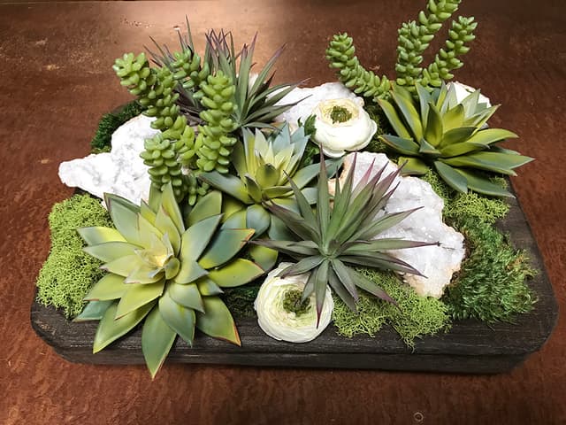 Faux succulent garden accented with natural geode crystals