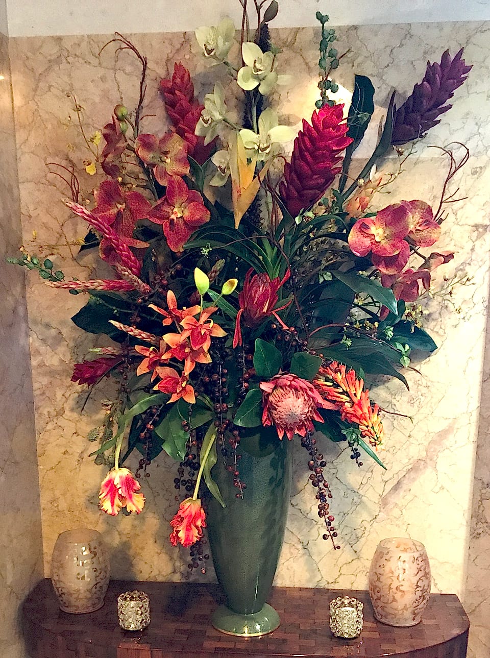 Vibrant tropical silk design with orchids, ginger, calla lilies, and tulips
